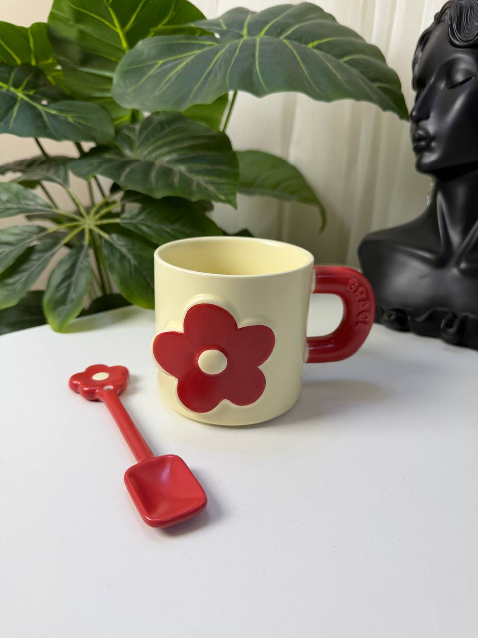 Mug with a spoon and shovel